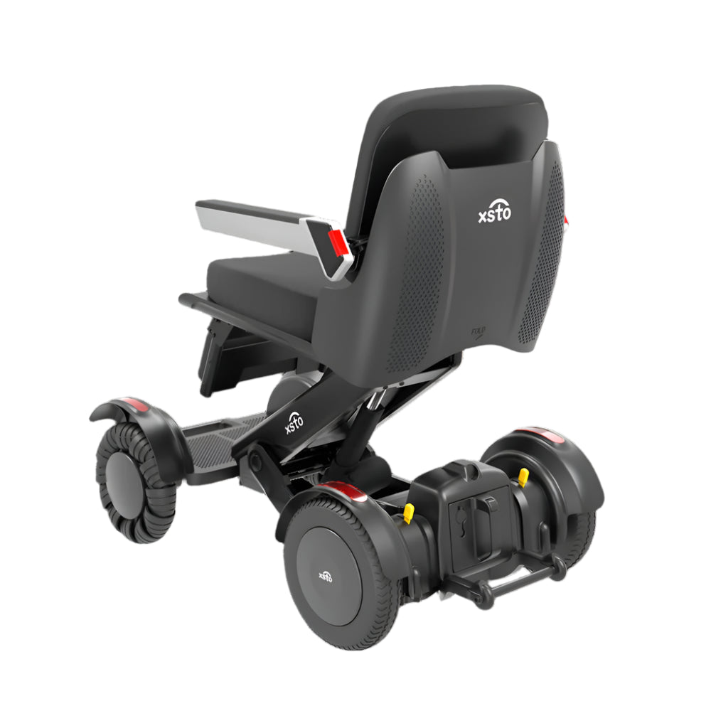 electric Wheelchair  back angle view showing wheels frame arm rest down