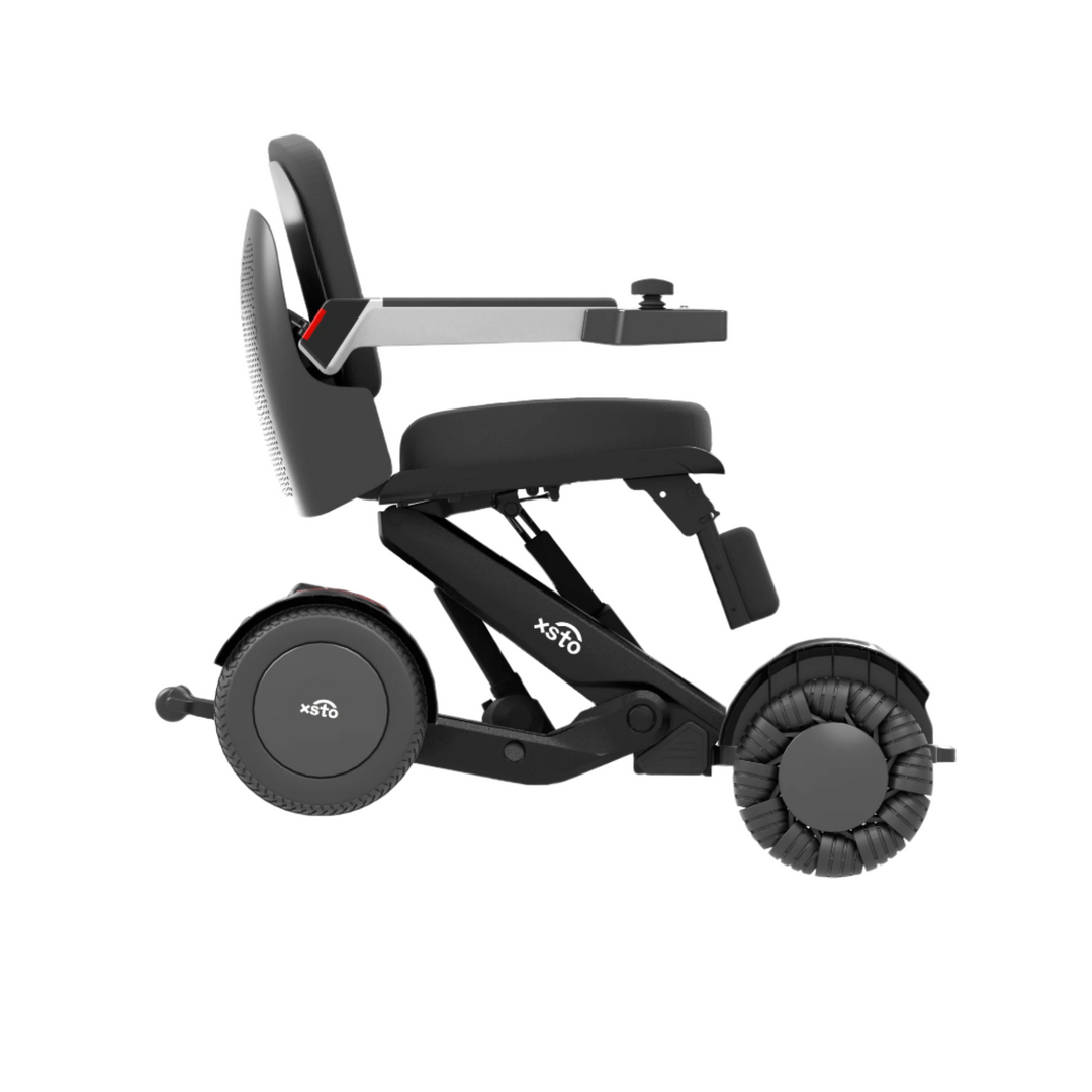 M4 Electric Wheelchair - by XSTO side view showing wheels frame arm rest down medium height