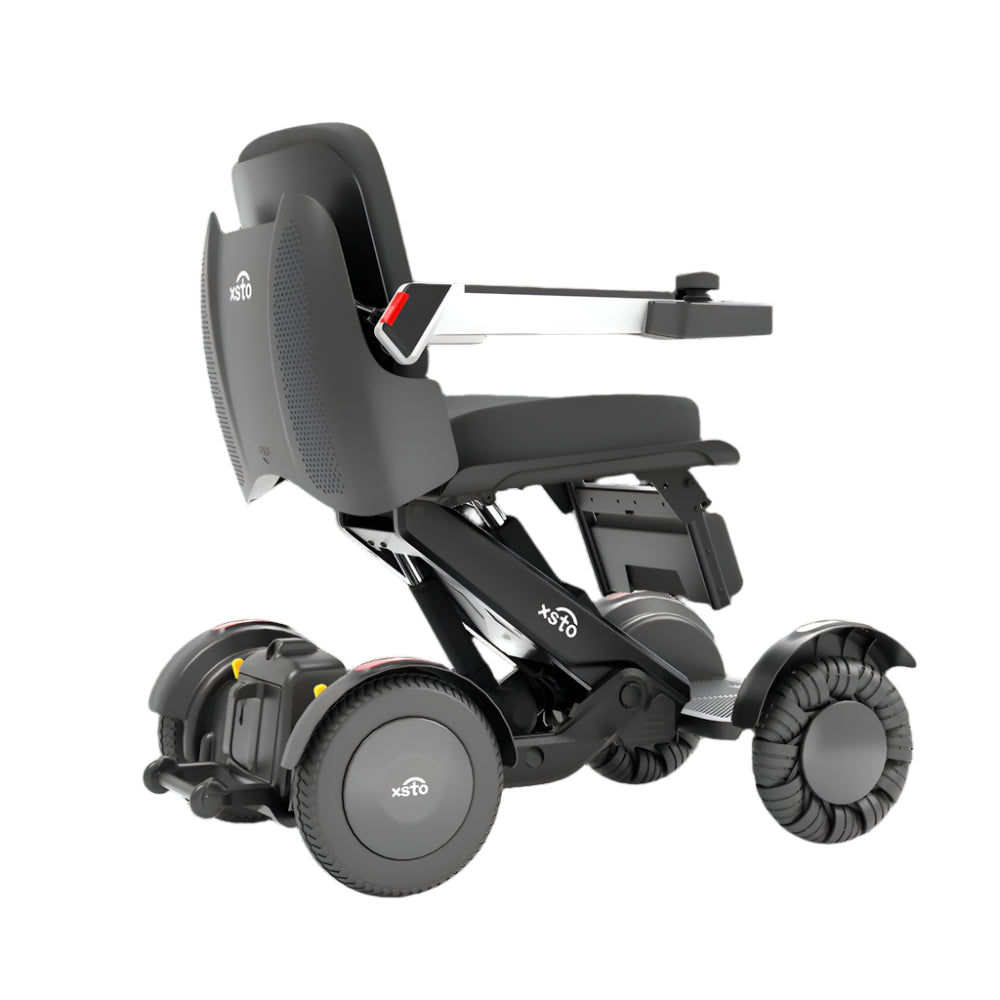 Electric Wheelchair -by XSTO side angle view showing wheels frame arm rest down