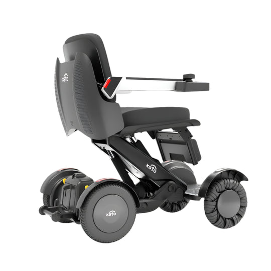 Electric Wheelchair -by XSTO side angle view showing wheels frame arm rest down