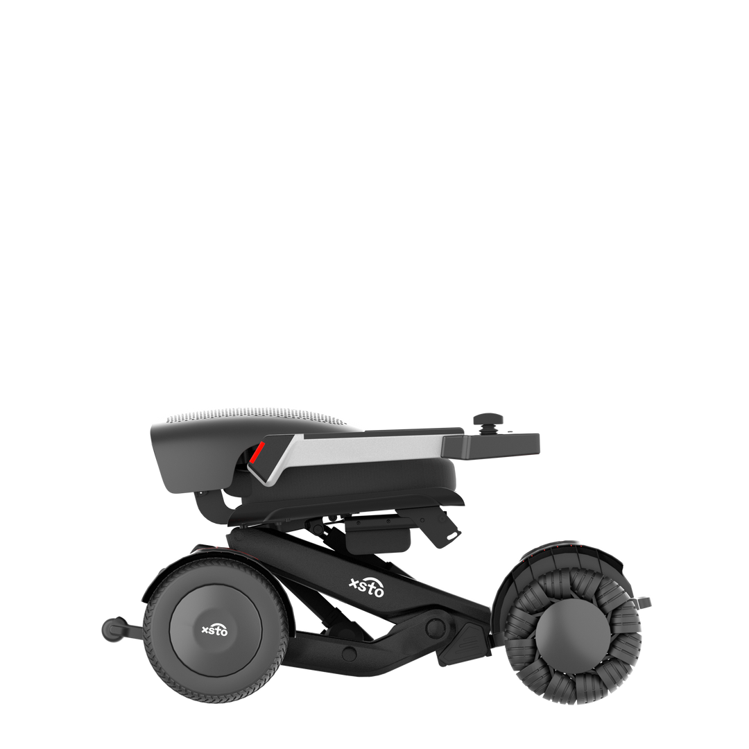 M4 Electric Wheelchair - by XSTO side view showing wheels frame arm rest down folded down