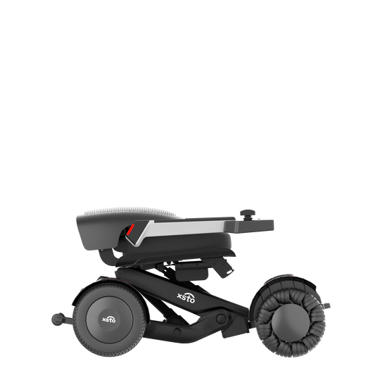 M4 Electric Wheelchair - by XSTO side view showing wheels frame arm rest down folded down